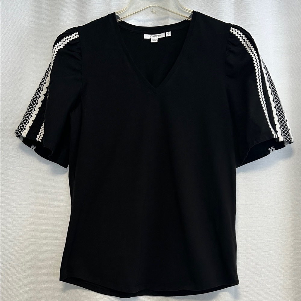 Chico's Elegant Black V-Neck Top with White Sleeve Detail